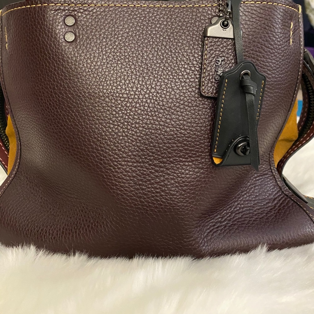 Coach Rogue;oxblood red and mustard yellow suede.